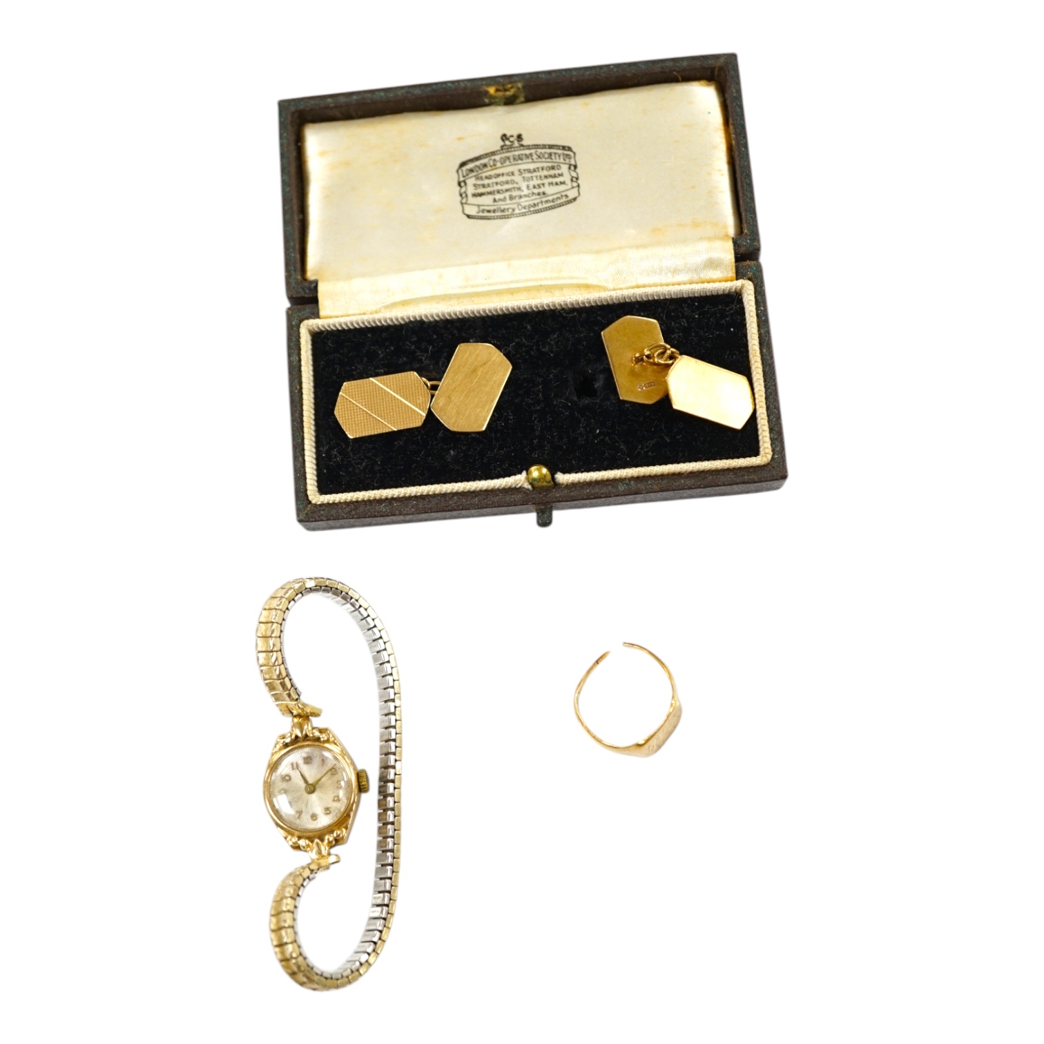 A pair of 9ct gold cufflinks, 5.8 grams, a yellow metal signet ring (a.f.) and a lady's 9ct gold manual wind wrist watch. Condition - poor to fair to good.